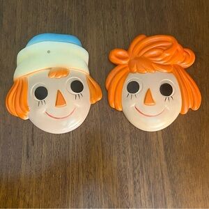 Raggedy Ann and Andy chalkware wall plaques, likely from the 1960s.